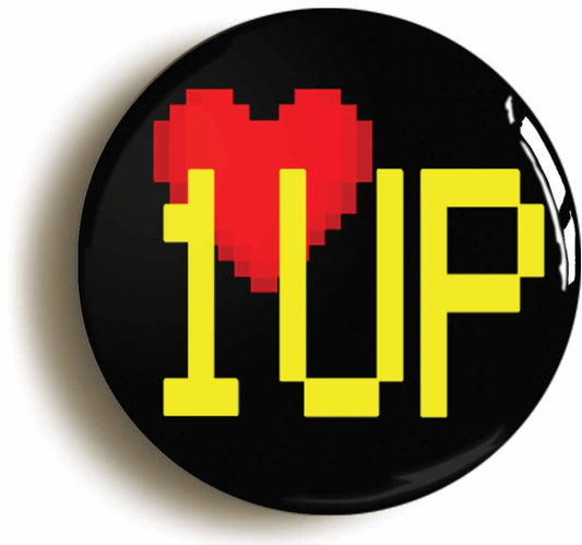 A picture of the front of the product, titled One Up Retro Gamer Geek 8 Bit Button Pin Badge