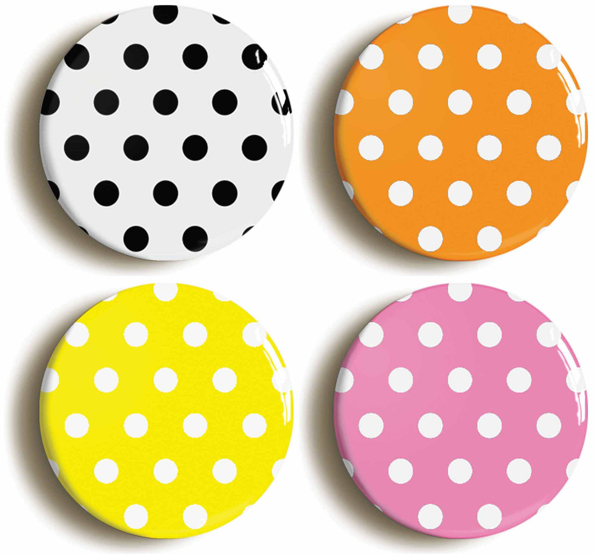 A picture of a set of four badges