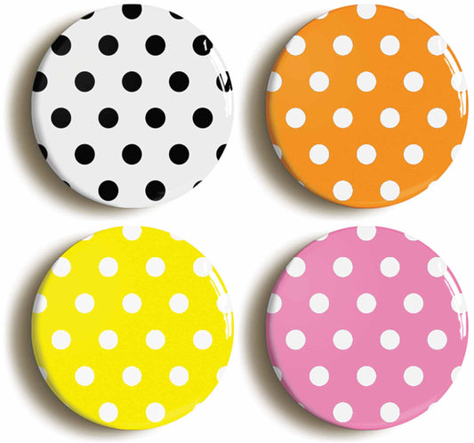 A picture of a set of four badges