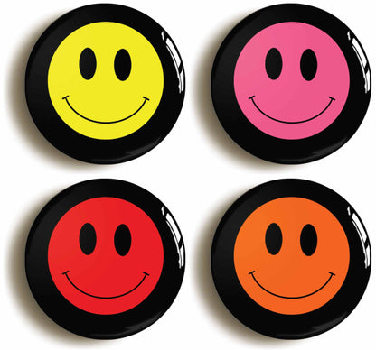 A picture of a set of four badges