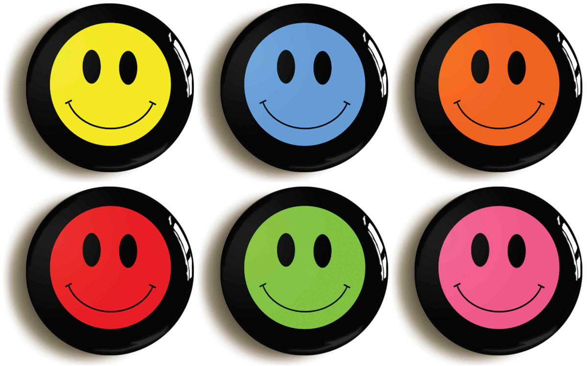 A picture of a set of six badges