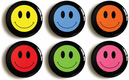A picture of a set of six badges