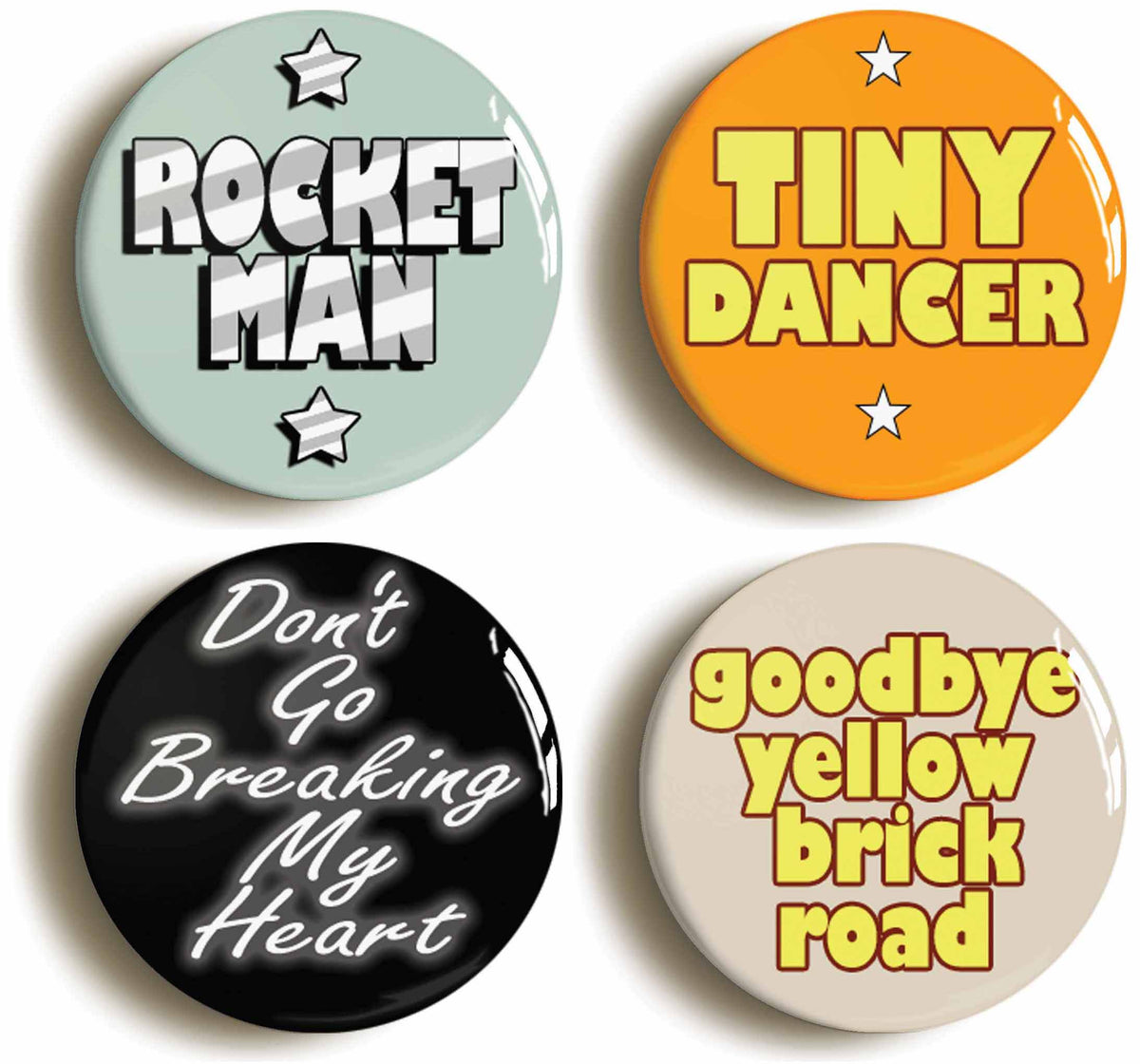 A picture of a set of four badges