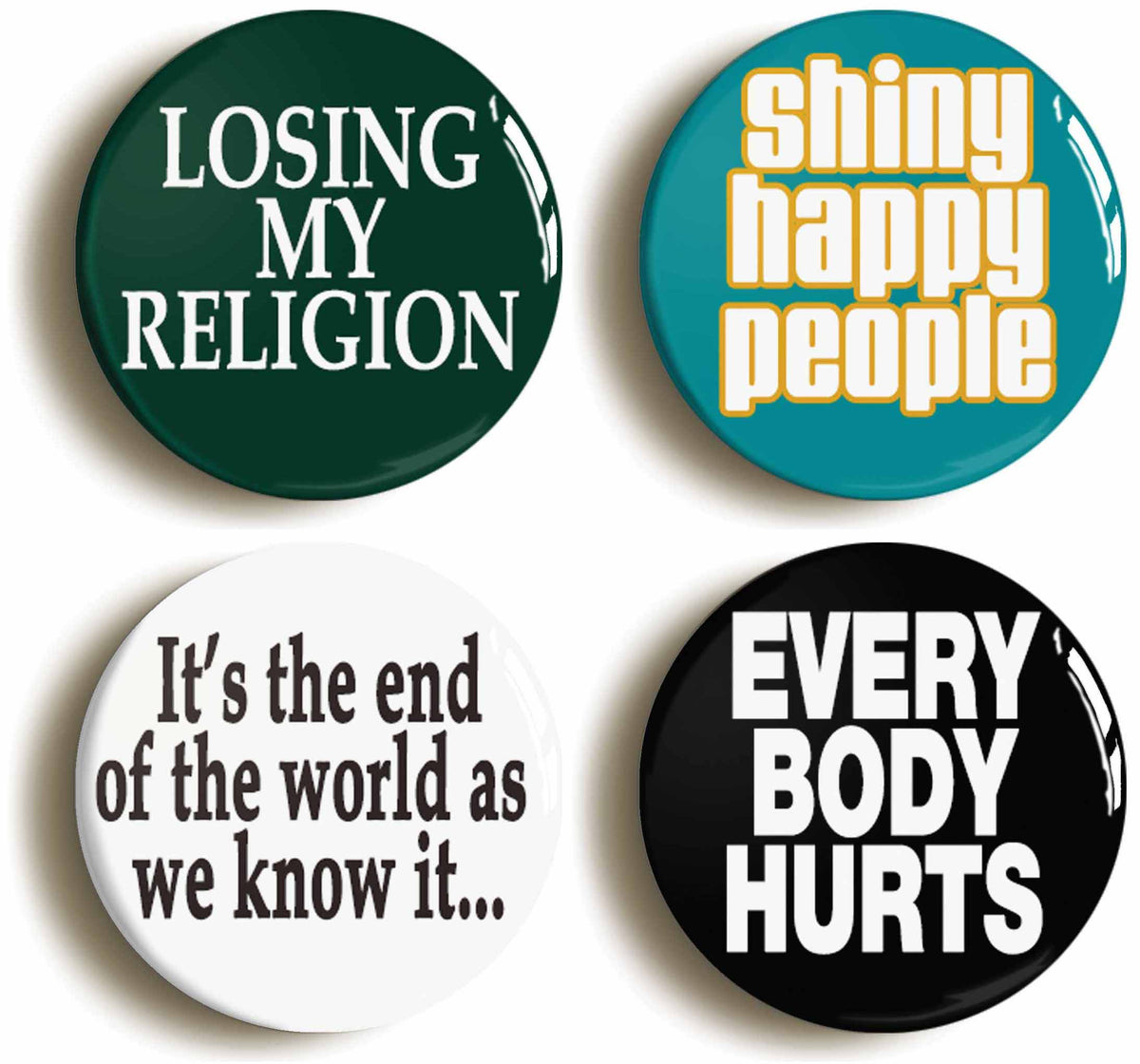 A picture of a set of four badges