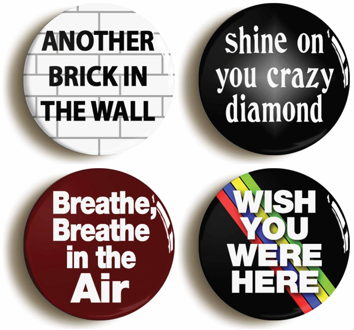 A picture of a set of four badges