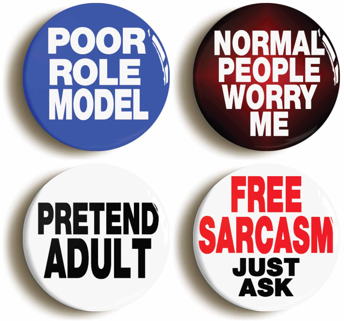 A picture of a set of four badges