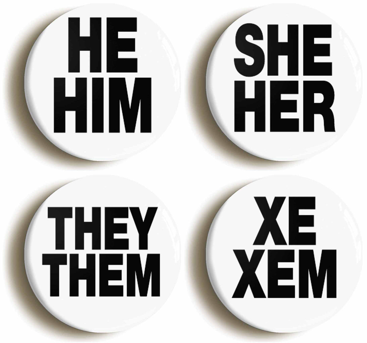 A picture of a set of four badges