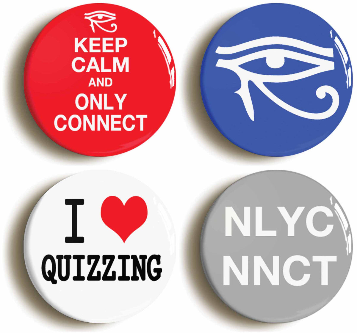 A picture of a set of four badges