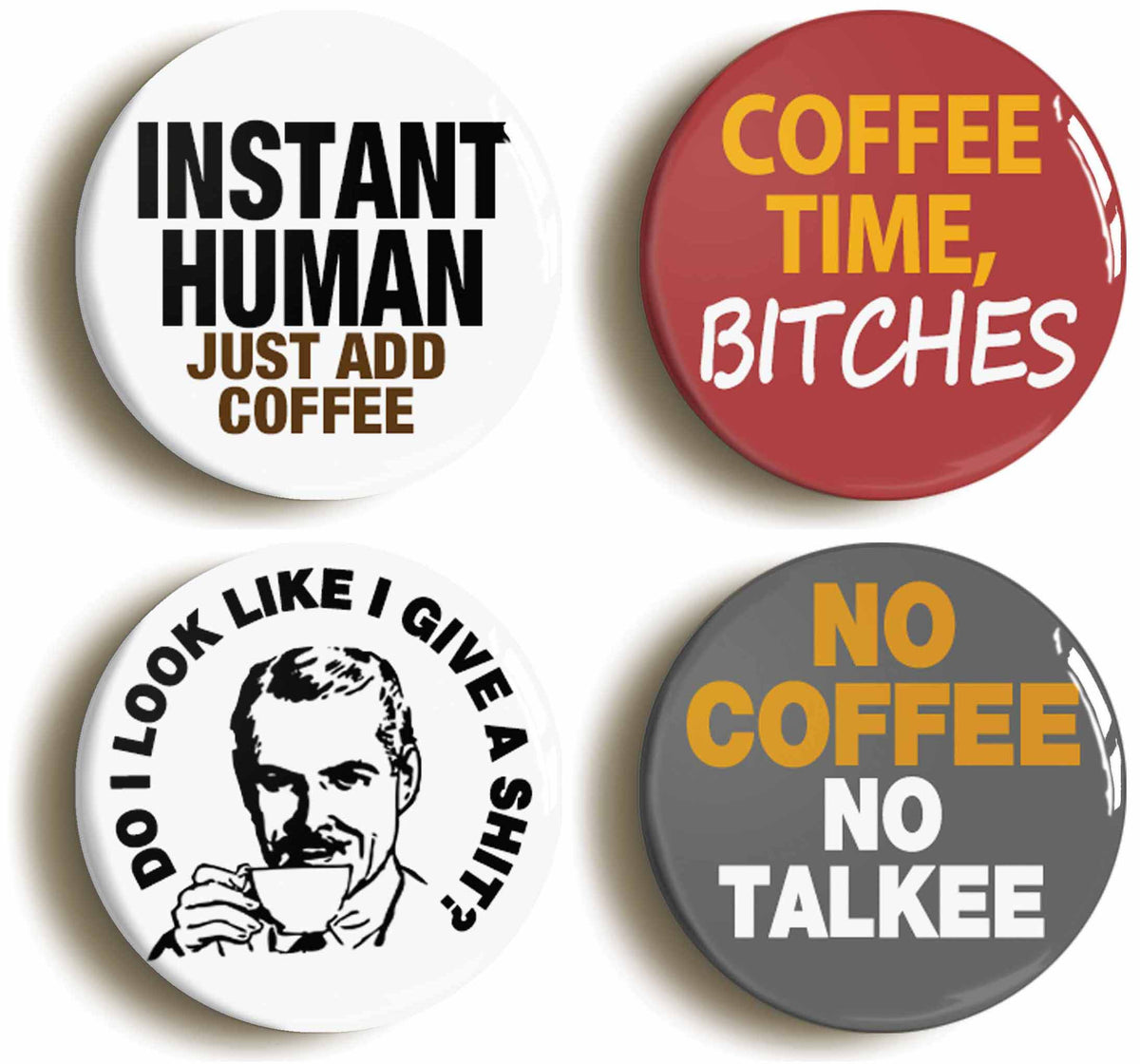 A picture of a set of four badges