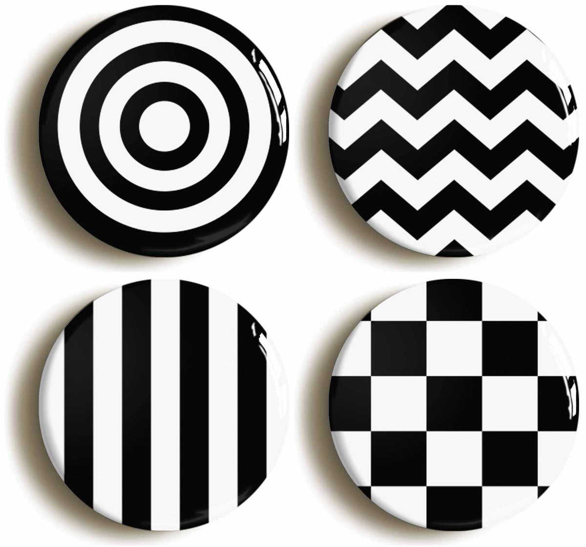 A picture of a set of four badges