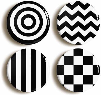 A picture of a set of four badges