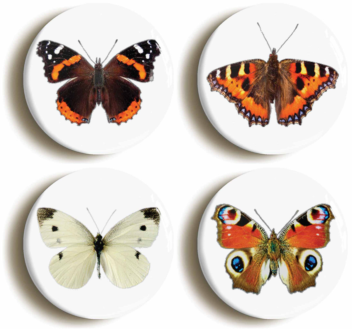 A picture of a set of four badges