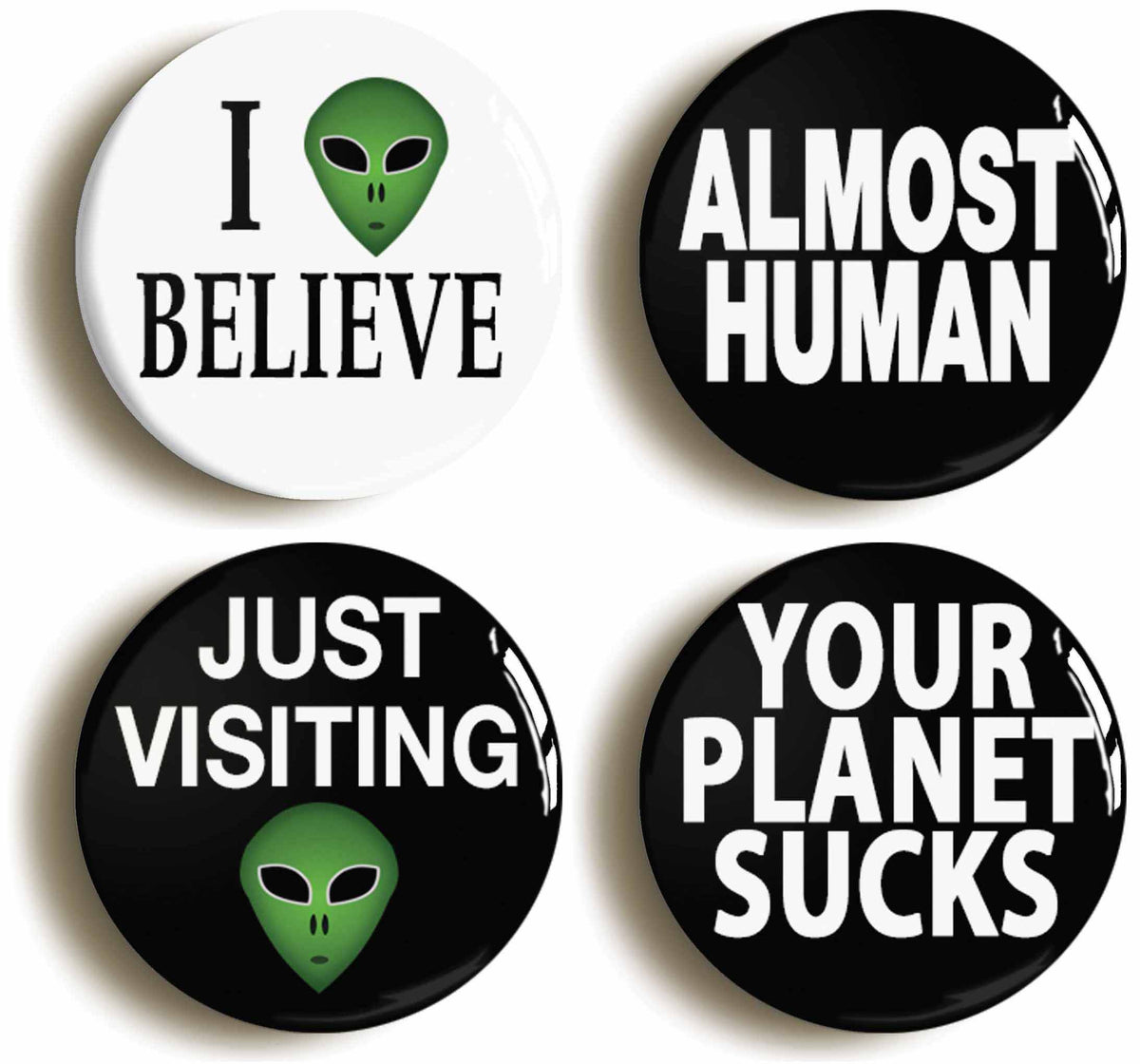 A picture of a set of four badges