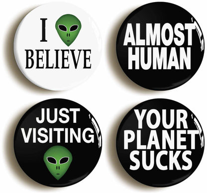 A picture of a set of four badges