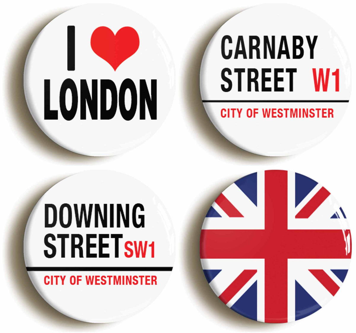A picture of a set of four badges