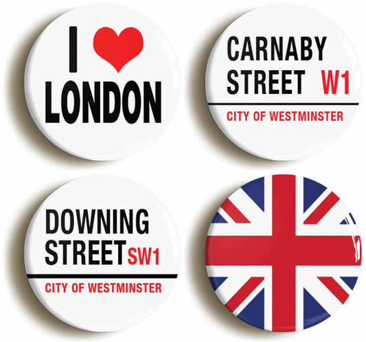 A picture of a set of four badges