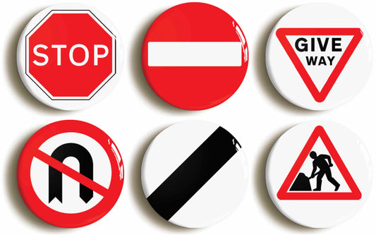 A picture of a set of six badges