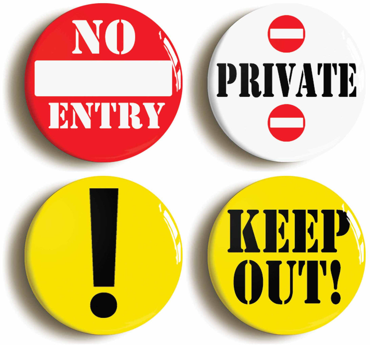 A picture of a set of four badges