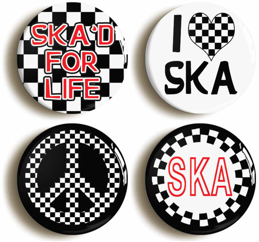 A picture of a set of four badges