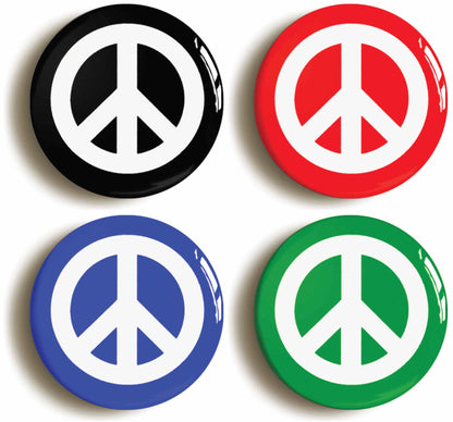 A picture of a set of four badges
