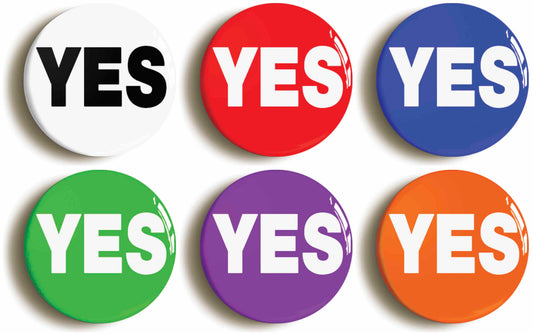 A picture of a set of six badges