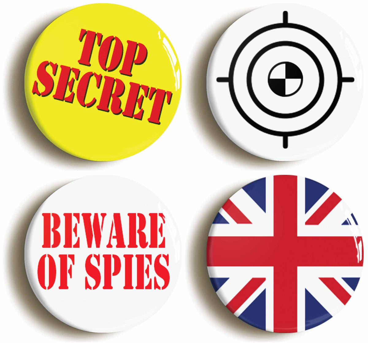 A picture of a set of four badges