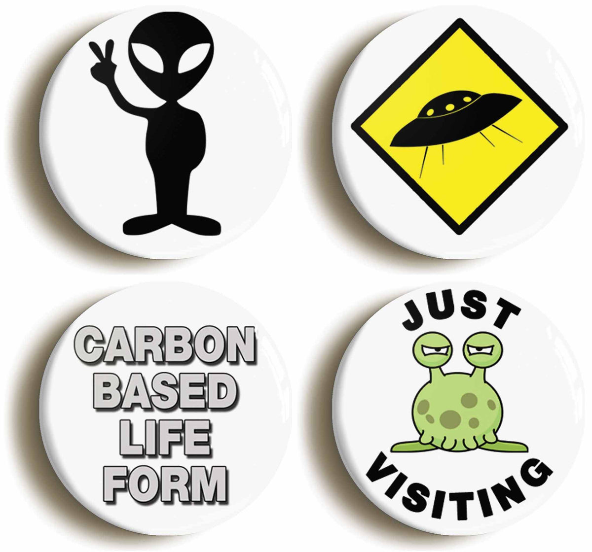 A picture of a set of four badges