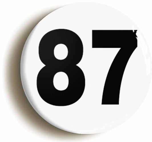A picture of the front of the product, titled Plain Number 87 Eighty Seven Button Pin Badge