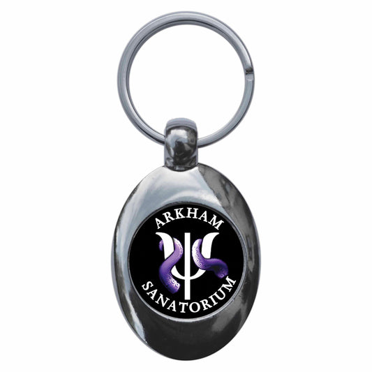 A picture of the front of the product, titled Arkham Sanatorium Metal Keyring With Trolley Coin