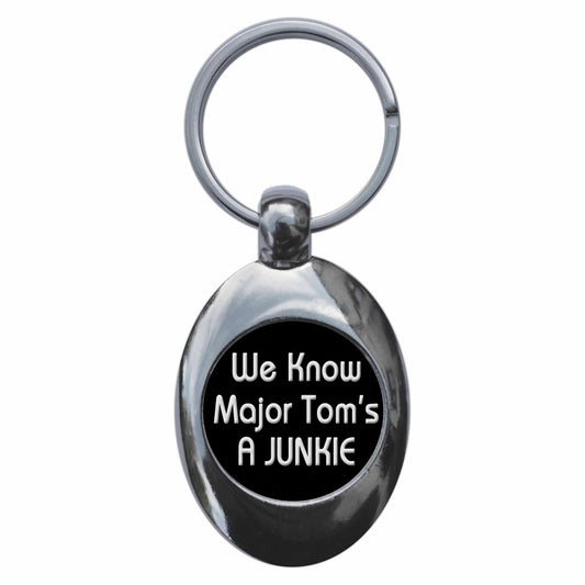 A picture of the front of the product, titled We Know Major Toms A Juniie Metal Keyring With Trolley Coin