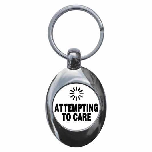 A picture of the front of the product, titled Attempting To Care Metal Keyring With Trolley Coin