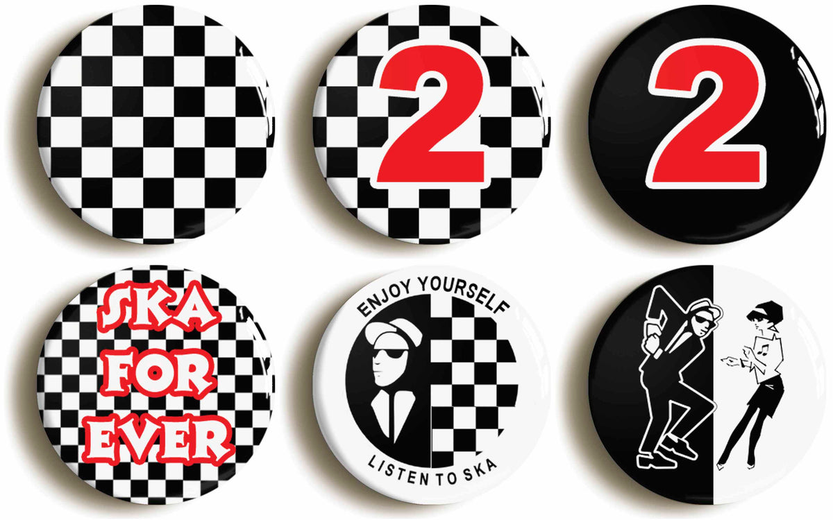 A picture of a set of six badges