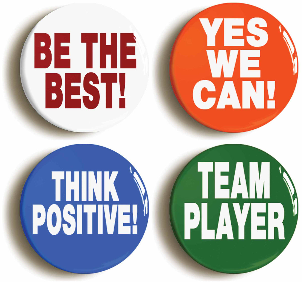 A picture of a set of four badges