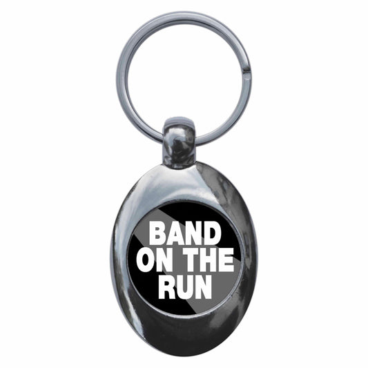 A picture of the front of the product, titled Band On The Run Metal Keyring With Trolley Coin