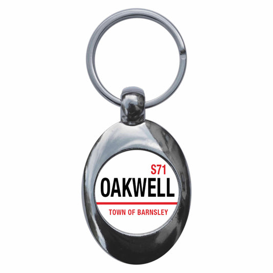 A picture of the front of the product, titled Oakwell Town Of Barnsley S71 Road Sign Metal Keyring With Trolley Coin