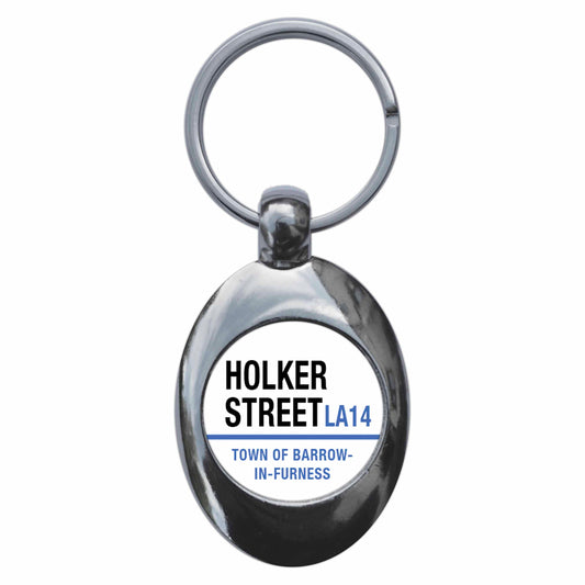 A picture of the front of the product, titled Holker Street LA14 Barrow In Furness Road Sign Metal Keyring With Trolley Coin