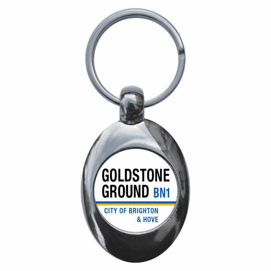 A picture of the front of the product, titled Goldstone Ground BN3 Brighton And Hove Road Sign Metal Keyring With Trolley Coin