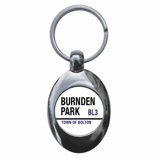 A picture of the front of the product, titled Burnden Park BL3 Town Of Bolton Road Sign Metal Keyring With Trolley Coin