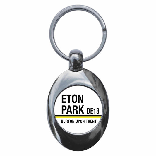 A picture of the front of the product, titled Eton Park DE13 Burton Upon Trent Road Sign Metal Keyring With Trolley Coin