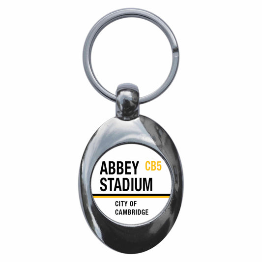 A picture of the front of the product, titled Abbey Stadium CB5 Cambridge Road Sign Metal Keyring With Trolley Coin