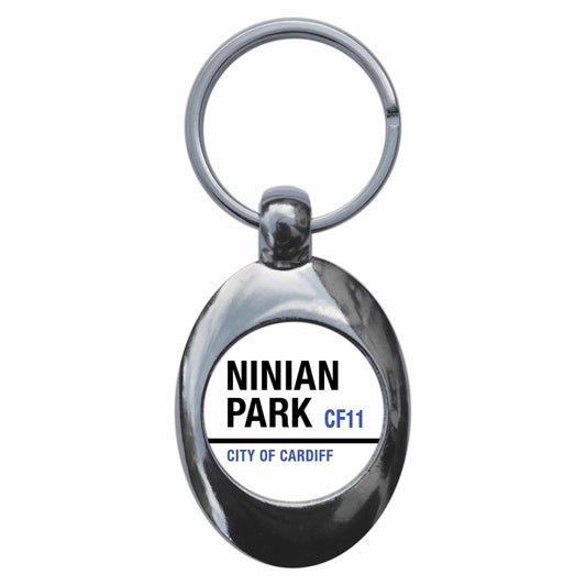 A picture of the front of the product, titled Ninian Park CF11 City Of Cardiff Road Sign Metal Keyring With Trolley Coin
