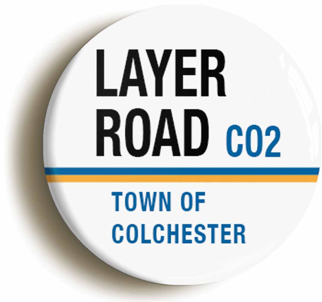 A picture of the front of the product, titled Layer Road CO2 Colchester Road Sign Button Pin Badge