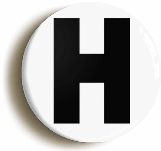 A picture of the front of the product, titled Letter H Button Pin Badge