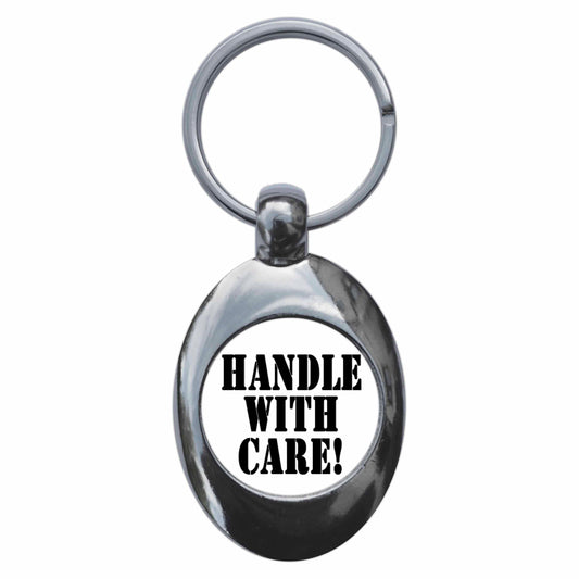 A picture of the front of the product, titled Handle With Care Metal Keyring With Trolley Coin