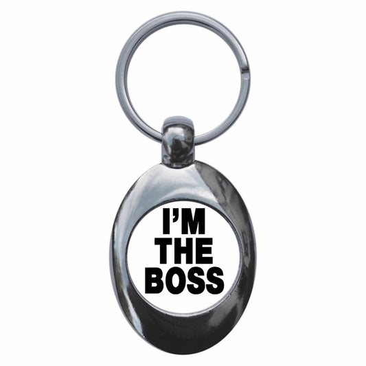 A picture of the front of the product, titled I'm The Boss Metal Keyring With Trolley Coin