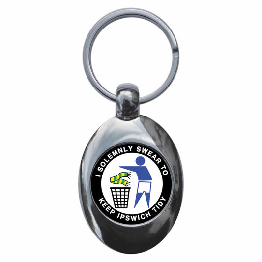 A picture of the front of the product, titled I Solemnly Swear To Keep Ipswich Tidy Metal Keyring With Trolley Coin