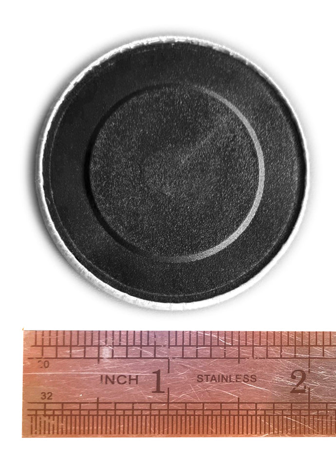 The rear of a fridge magnet shown to scale with a ruler measured in inches