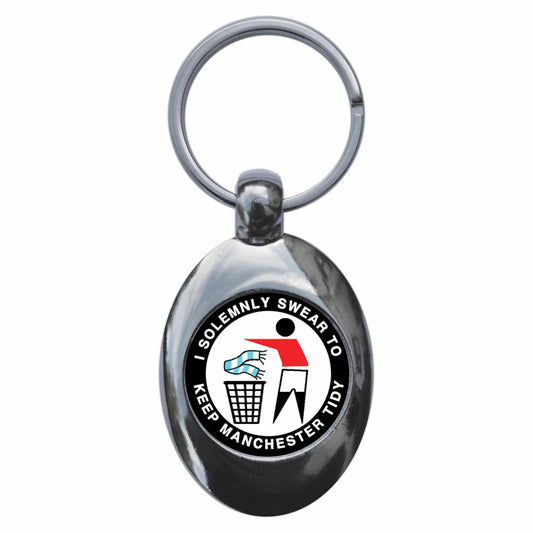 A picture of the front of the product, titled I Solemnly Swear To Keep Manchester Tidy - U Metal Keyring With Trolley Coin