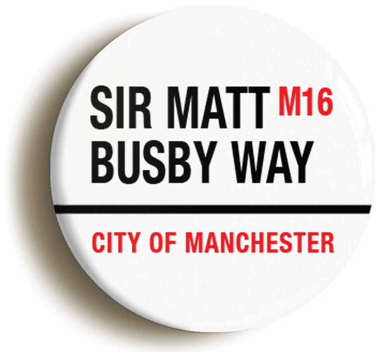 A picture of the front of the product, titled Sir Matt Busby Way M16 City Of Manchester Road Sign Button Pin Badge