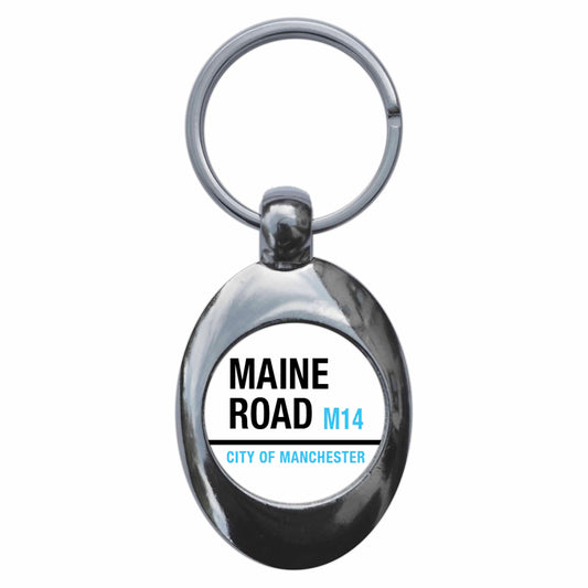 A picture of the front of the product, titled Maine Road M14 City Of Manchester Road Sign Metal Keyring With Trolley Coin